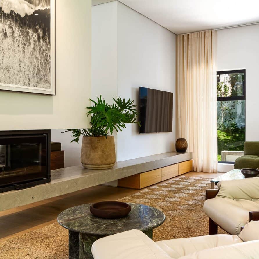Modern living room interior with contemporary decor and natural light, showcasing innovative development solutions.